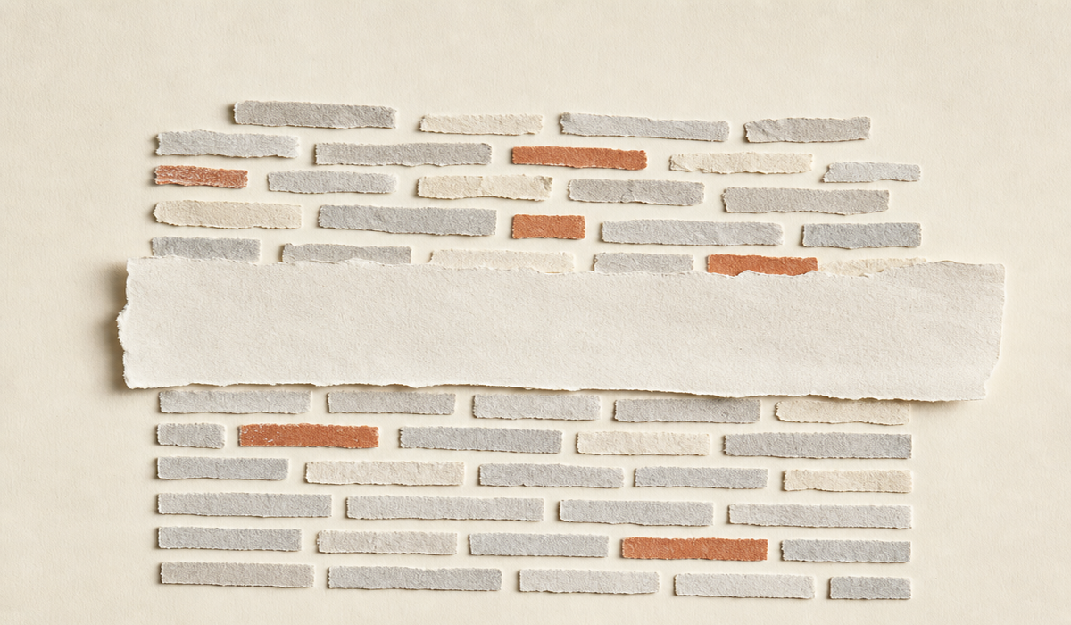 Cut-paper strips laid in rows like receipts, one wide blank strip breaking the pattern
